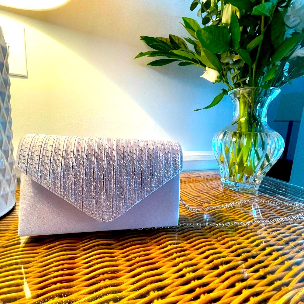 Small formal clutch with detachable strap